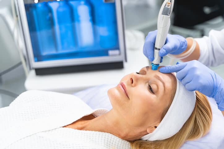Close-up of a client receiving a hydradermabrasion treatment from a certified aesthetician