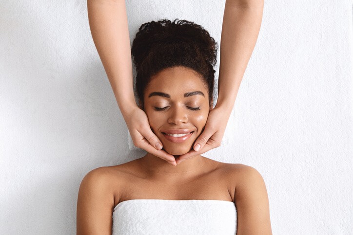 Client receiving a facial treatment from a certified Spa Therapist.